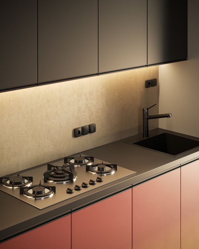 A modern kitchen interior featuring a sleek countertop, gas stove, and stainless steel faucet.